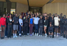 ‘I can’t stop smiling’: How a Black run club is bringing community to Ottawa sidewalks A group of dozens of people in athletic wear stand in front of a building