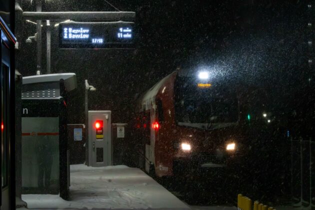 An O-Train pulls into the station at Carleton