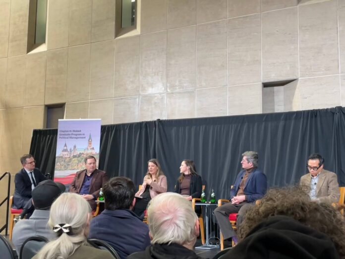 People sitting on stage talking about artificial intelligence.