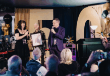 ‘They said we’d never make it past 10 years’: A community radio station’s survival guide An audience with a man speaking and two woman by his side