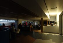 In photos: Carleton students left in the dark after Monday morning campus power outage Students studying at tables in darkness, with one overhead light shining.