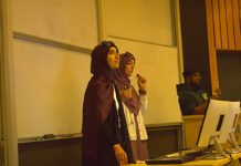 How Carleton’s Muslim Students’ Association is already preparing for February’s Islam Awareness Week Three people stand in front of a whiteboard, with one holding a microphone up to their face