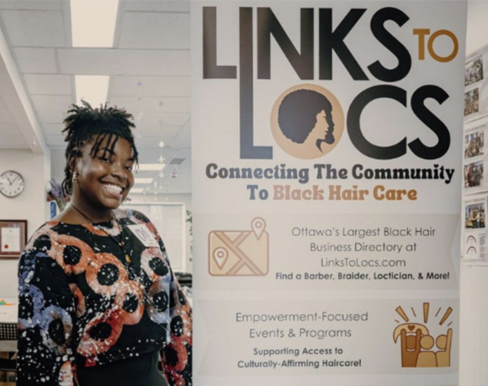 Screenshot 2026-01-14 at 12.25.34 PM Woman in front of a poster that reads