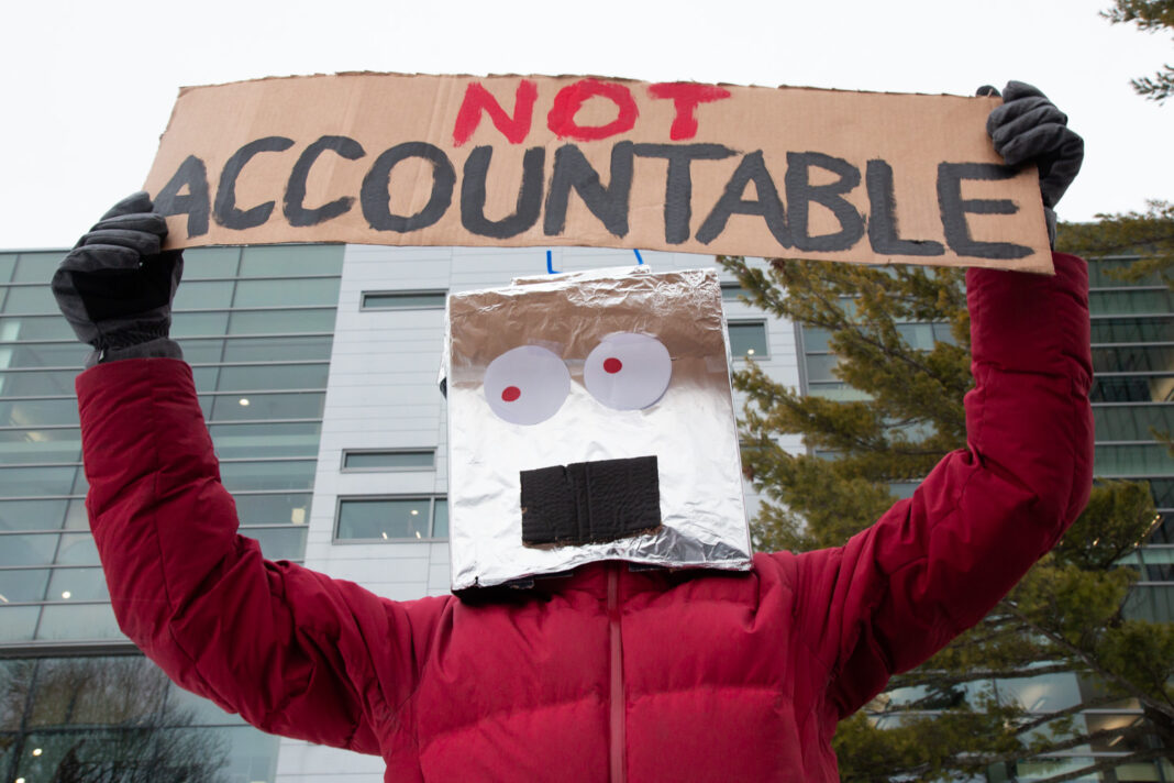 Person holding a sign over their head.