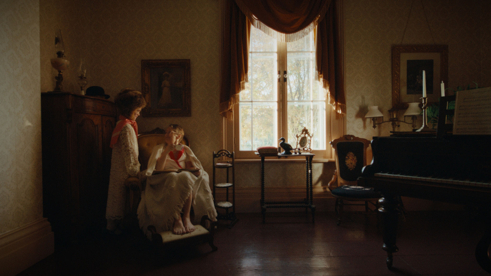 People sitting in dimly lit room.