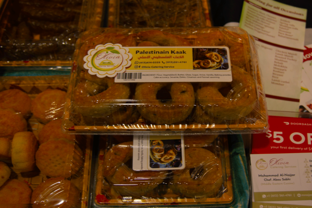 Plastic boxes are filled with pastries, some with holes in the middle