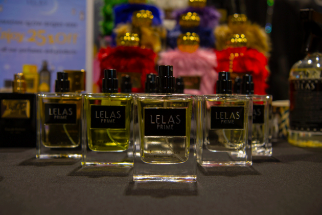 More than five square bottles of clear liquid with labels saying "Lelas Prime" sit on a table