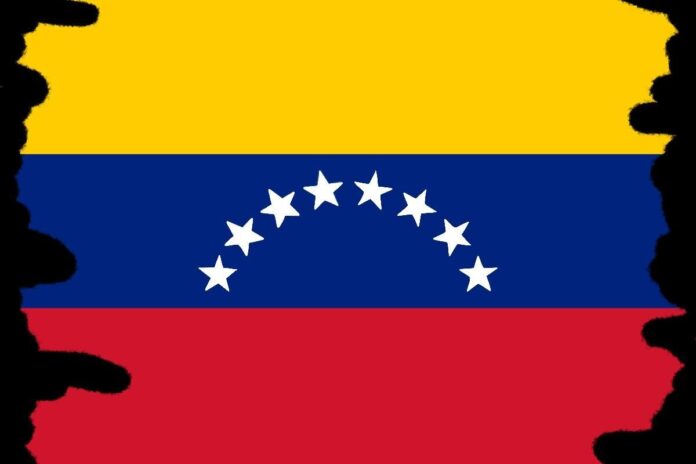 The Venezuelan flag, with a yellow, blue and red stripe, as well as a half circle of stars