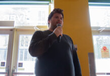 BREAKING: Maxwell Heroux wins CUSA presidency; voter turnout plummets to single digits Maxwell Heroux speaks on a microphone