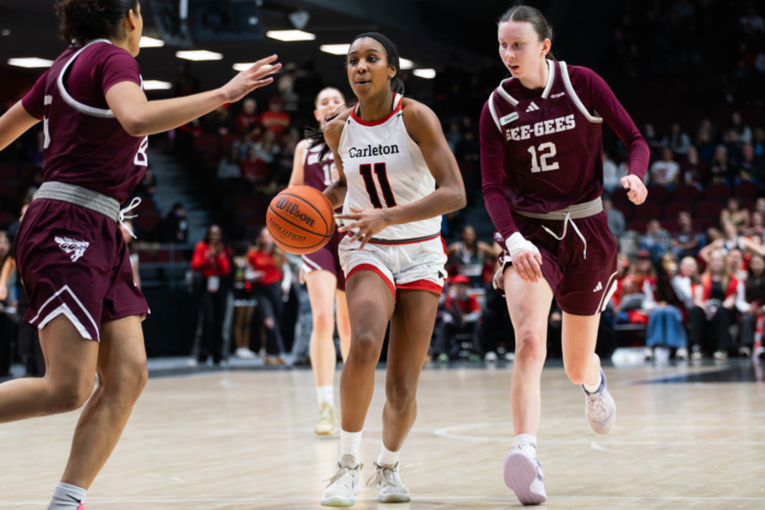sCAPHOOPSW-3 Carleton University player dribbles basketball