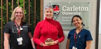 From sweet treats to high-pressure simulations, here’s how Carleton’s new nursing program is shaping up Three women - one in black, another in red and another in blue scrubs standing in front of a Carleton University sign.