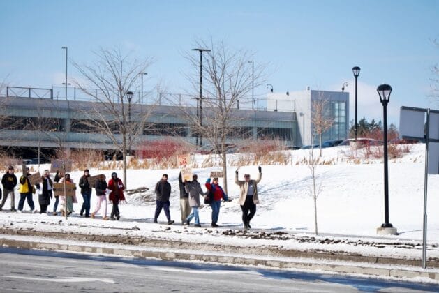 Students walking on University Drive at Carleton University