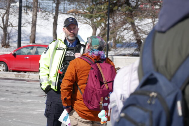 Special constable and attendee having.a conversation