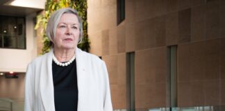 Q&A: How growing up near a rural post office made Susan Phillips into an Order of Canada recipient Susan Phillips looks toward a window.