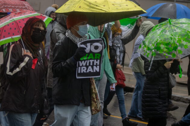 Protest attendee holds a sign