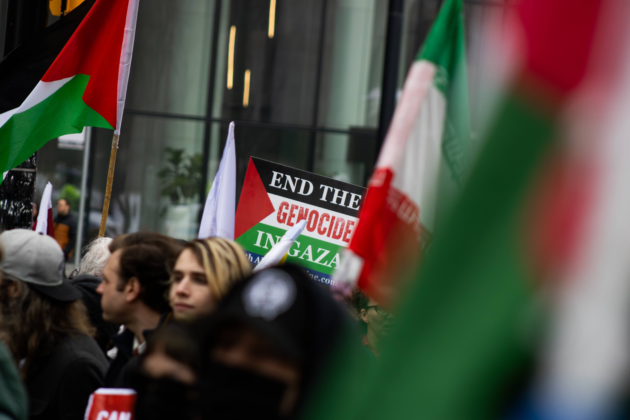 Sign in a crowd of protestors