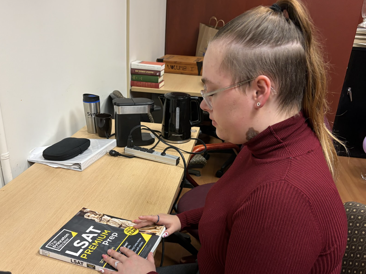 A woman starting to read the LSAT