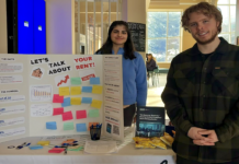 No Room for Students: How a CUSA report is highlighting student rent issues Two people stand at a table with a fold-out cardboard poster with sticky notes and a message that says "Let's talk about rent, your rent"