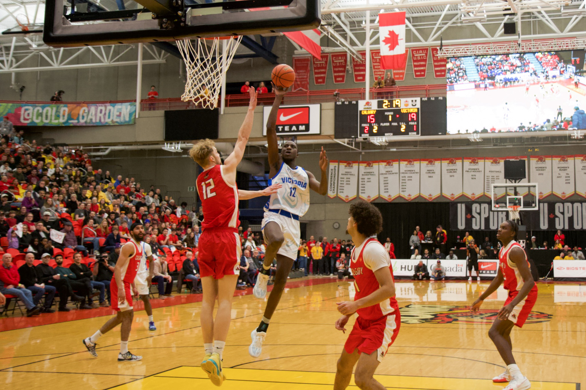 Basketball layup by Victoria player