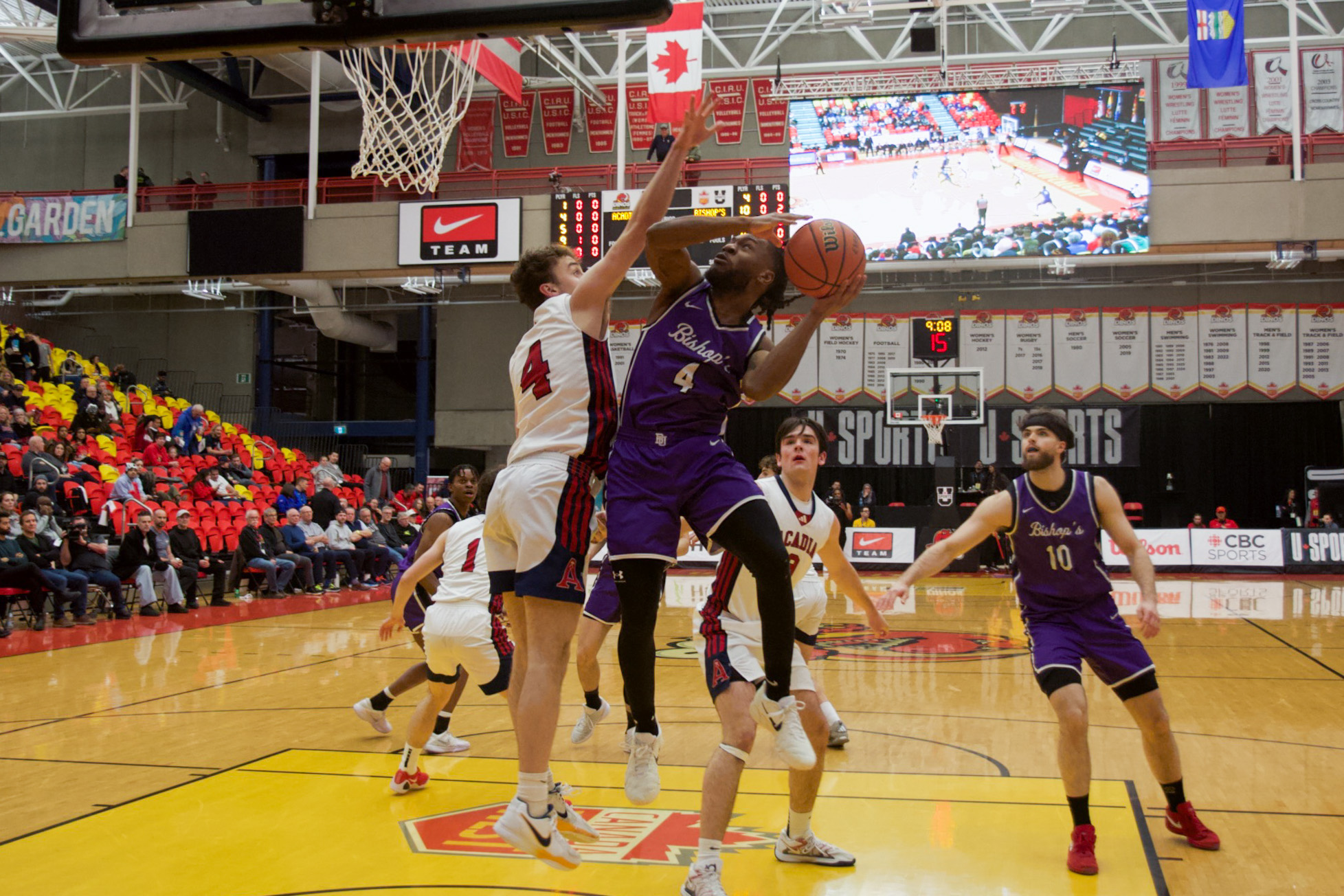 Basketball layup by Bishops player