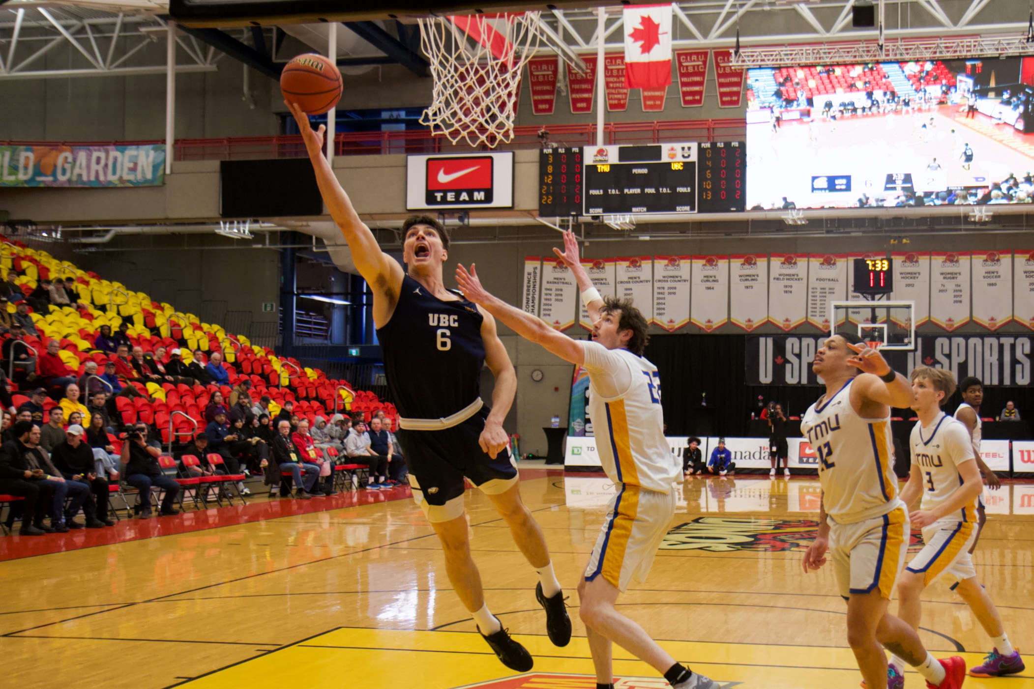 Person goes for a layup in basketball