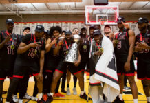 NATIONAL CHAMPIONS: Aubrey Dorey-Havens lifts the Ravens to their 18th U SPORTS national title Trophy photo
