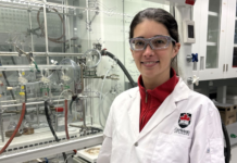 Q&A: Award-winning professor is ‘blowing up’ explosion research Kate Marczenko wearing a white lab coat in a lab.