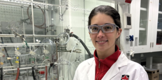 Q&A: Award-winning professor is ‘blowing up’ explosion research Kate Marczenko wearing a white lab coat in a lab.