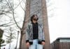 Q&A: Meet Carleton’s new group raising awareness on political injustice in the Philippines A person stands in front of Dunton Tower, a building at Carleton University.