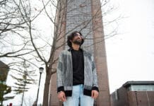 Q&A: Meet Carleton’s new group raising awareness on political injustice in the Philippines A person stands in front of Dunton Tower, a building at Carleton University.