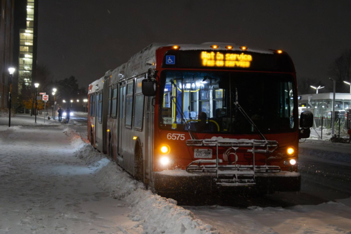 An OC Transpo bus parked on the road.