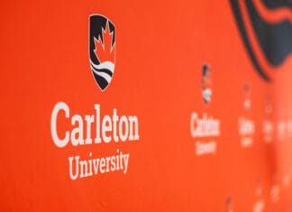 Pro-Palestine protesters interrupt Carleton convocation, renew divestment demands Carleton University logo and text