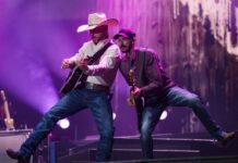Bluesfest Day 1 review: Cody Johnson delivers fireworks and musical insights under cloudy skies Guitarists perform beside one another on stage