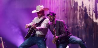 Bluesfest Day 1 review: Cody Johnson delivers fireworks and musical insights under cloudy skies Guitarists perform beside one another on stage