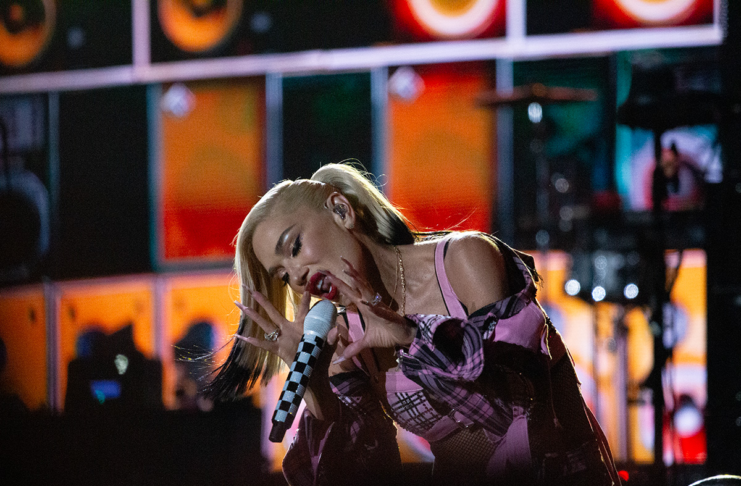 Bluesfest Day 8 review: Gwen Stefani delivers the ultimate ‘90s throwback Woman sings into mic while kneeling down on stage