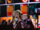 Bluesfest Day 8 review: Gwen Stefani delivers the ultimate ‘90s throwback Woman sings into mic while kneeling down on stage