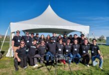 Carleton’s Blackbird UAV design team stands out at national competition Blackbird team members stand in front of a white tent.