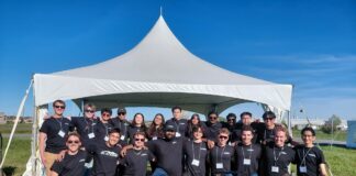 Carleton’s Blackbird UAV design team stands out at national competition Blackbird team members stand in front of a white tent.