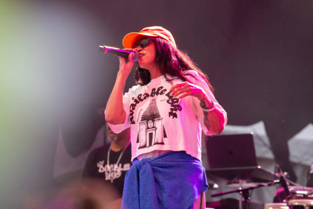 Woman sings with microphone