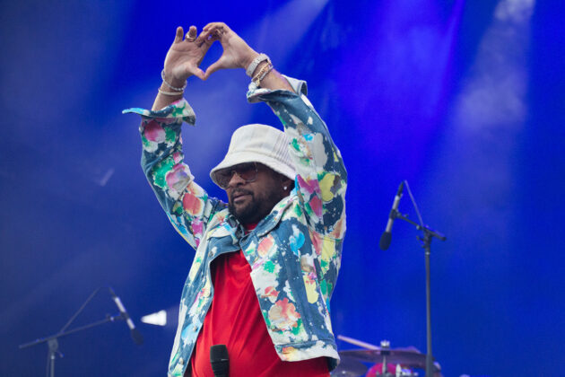 Man makes heart hands on stage
